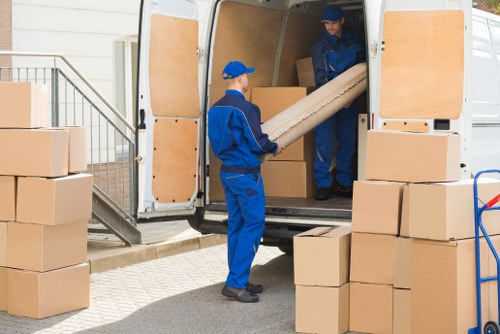 Man and van loading furniture for a local move in Pinner