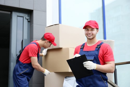 Loading furniture into a moving truck for a Pinner relocation