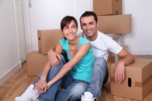 Professional movers handling furniture in a Pinner home
